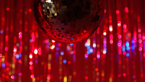Close-Up-Of-Mirrorball-In-Night-Club-Or-Disco-With-Flashing-Strobe-Lighting-And-Sparkling-Lights-In-Background-5